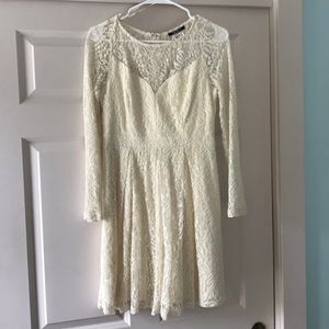 Janelle James White lace dress